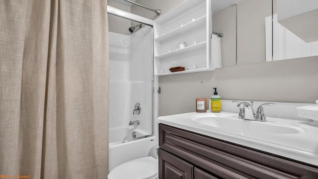 full bathroom with vanity, shower / tub combo, and toilet