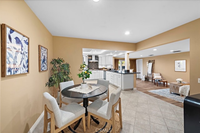 dining space with light hardwood / wood-style floors