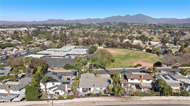 birds eye view of property featuring a mountain view