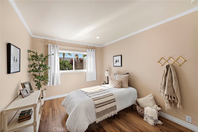 bedroom with wood-type flooring and ornamental molding