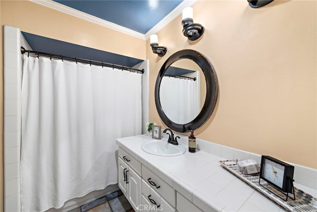 bathroom with vanity, curtained shower, and ornamental molding