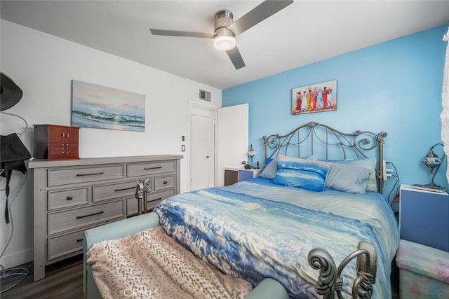 bedroom featuring ceiling fan and dark hardwood / wood-style floors