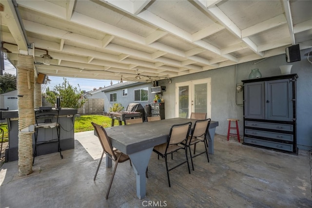 view of patio featuring french doors and a bar