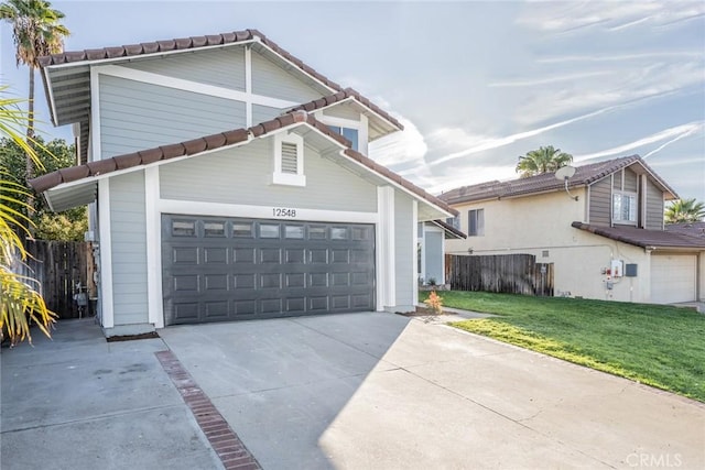 view of front property featuring a front lawn and a garage