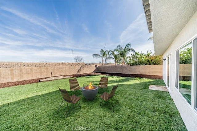 view of yard featuring a fire pit