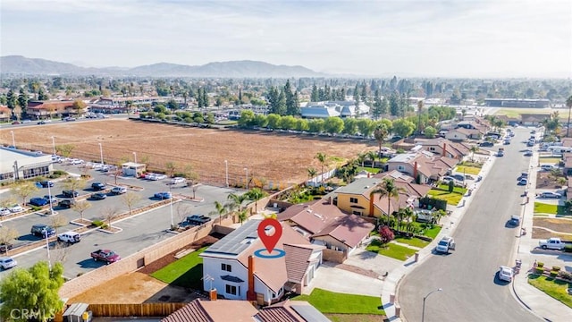 birds eye view of property with a mountain view