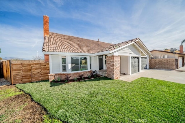 view of front facade with a front lawn and a garage