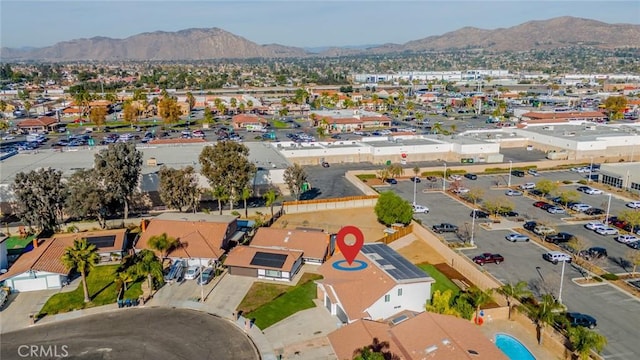 birds eye view of property with a mountain view