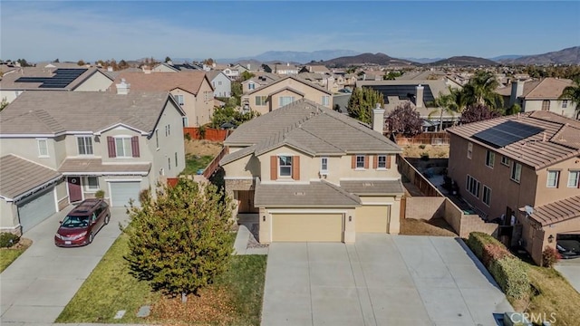 birds eye view of property with a mountain view