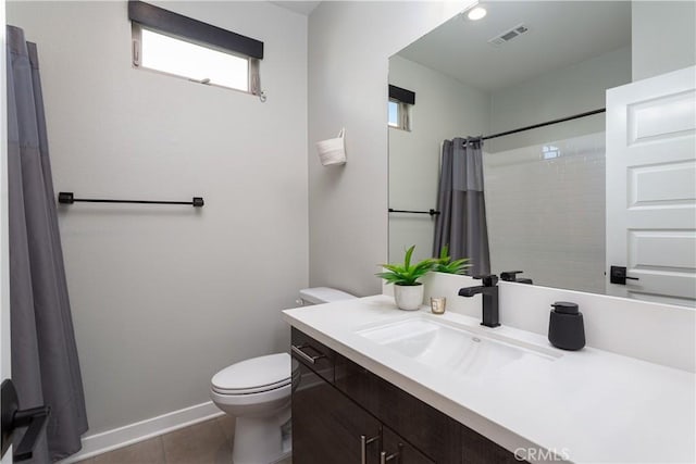 bathroom with toilet, a shower with curtain, tile patterned floors, and vanity