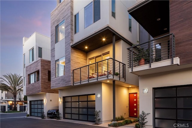 outdoor building at dusk with a garage