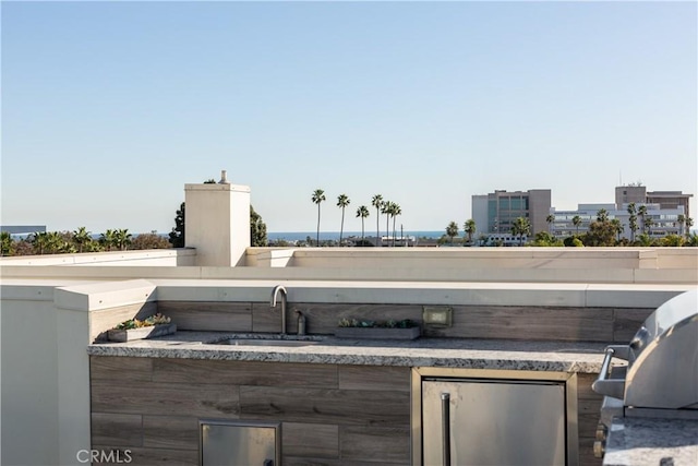 view of patio / terrace with sink and area for grilling