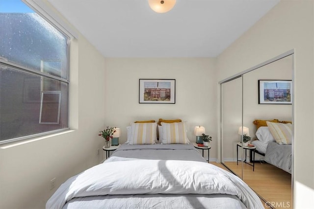 bedroom featuring a closet and light hardwood / wood-style floors