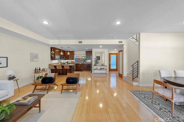 living room with light hardwood / wood-style flooring