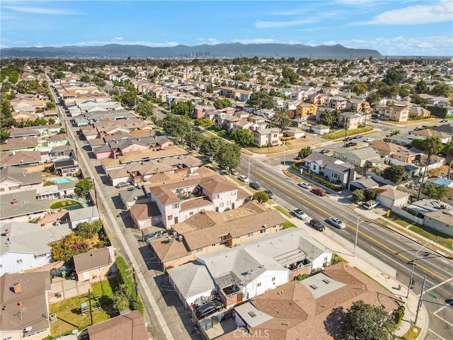 birds eye view of property featuring a mountain view