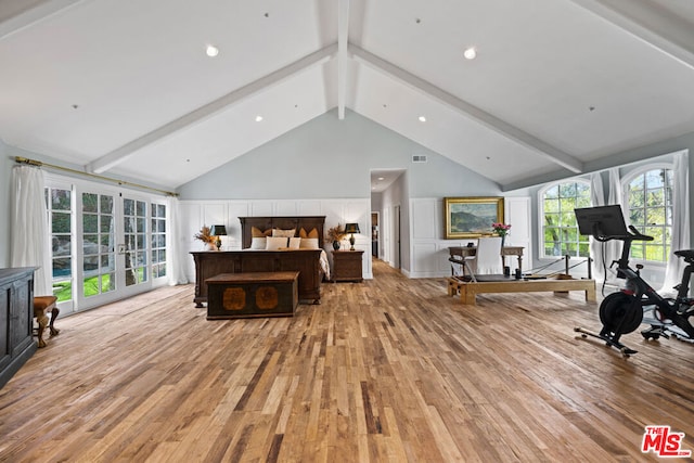 exercise area with light wood-type flooring, french doors, and high vaulted ceiling