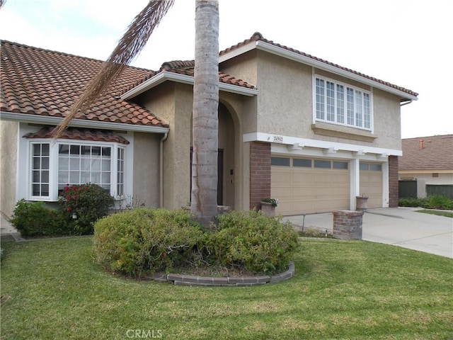 view of front of home with a garage and a front lawn