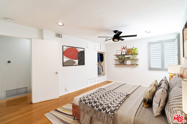 bedroom featuring hardwood / wood-style flooring and ceiling fan