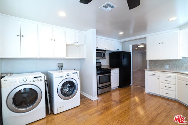 washroom with washer and clothes dryer, hardwood / wood-style flooring, and ceiling fan