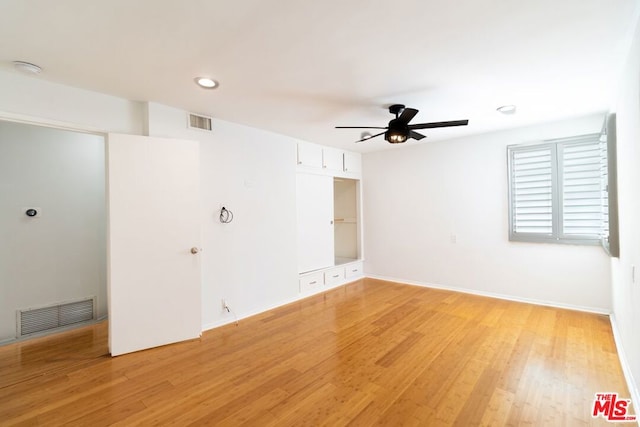 spare room with ceiling fan and light hardwood / wood-style floors