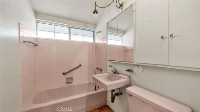 full bathroom featuring toilet, sink, and  shower combination