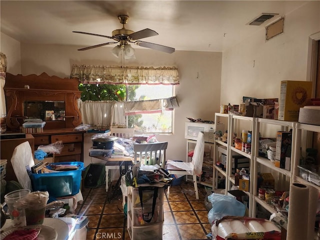 interior space with ceiling fan and tile patterned flooring