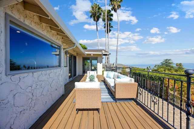 wooden terrace featuring an outdoor hangout area