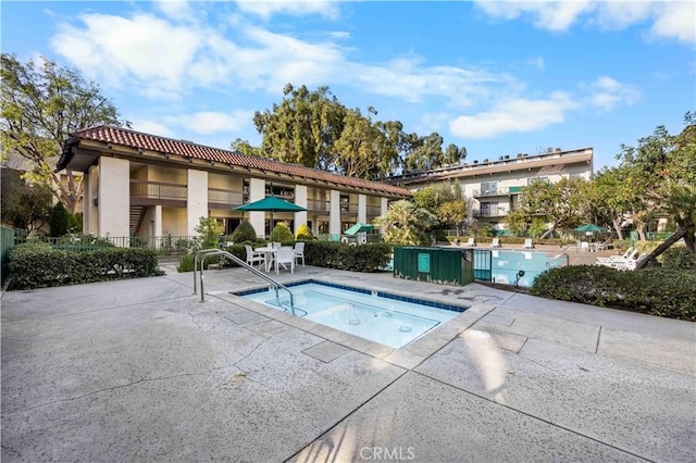 view of swimming pool featuring a patio area