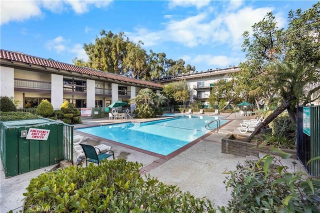 view of swimming pool featuring a patio area