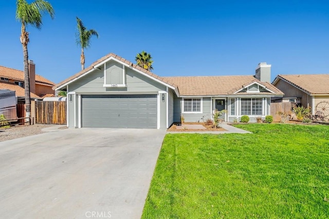 ranch-style home with a front yard and a garage