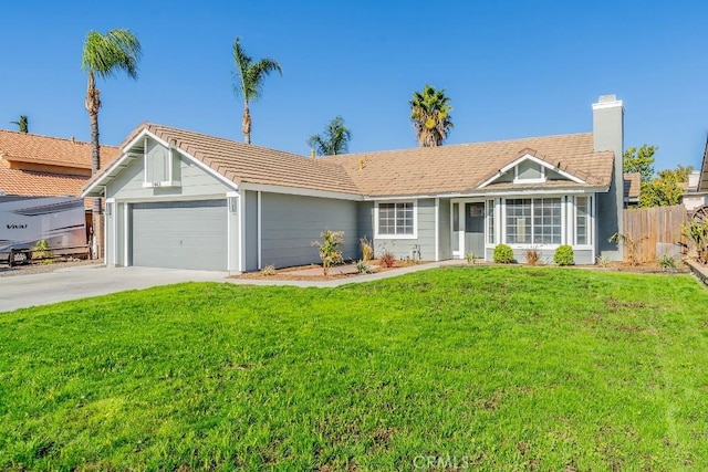 ranch-style home featuring a front lawn and a garage