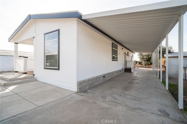 view of property exterior with a carport