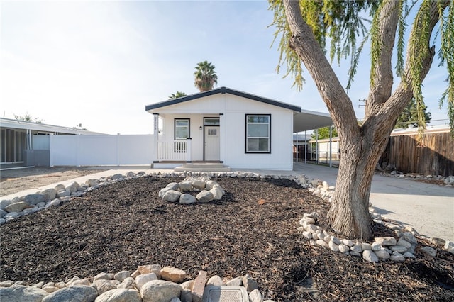 view of front of home with a carport