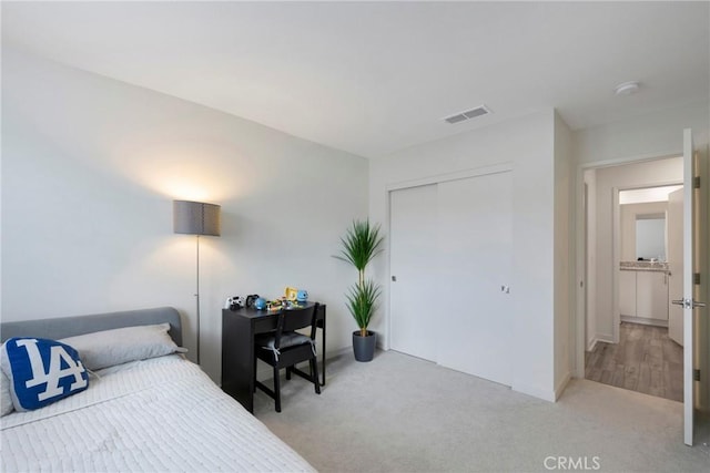 carpeted bedroom featuring a closet