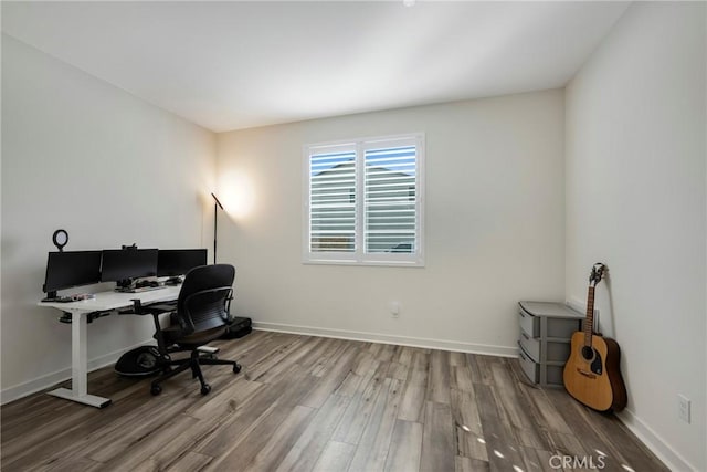 home office with wood-type flooring