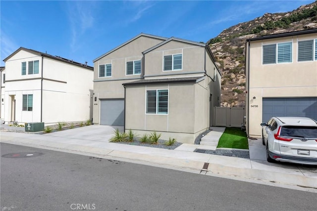 view of front property with a garage and a mountain view