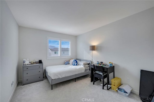 bedroom with light colored carpet