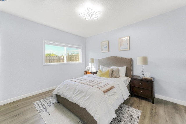 bedroom with hardwood / wood-style floors