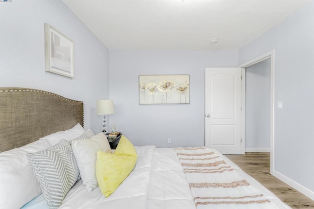 bedroom with light hardwood / wood-style flooring