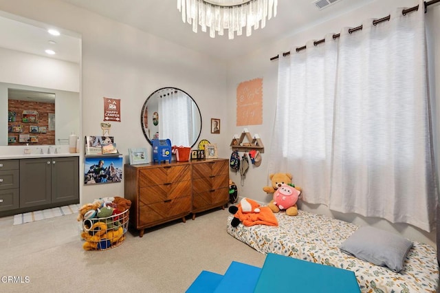 bedroom with light carpet, sink, an inviting chandelier, and multiple windows