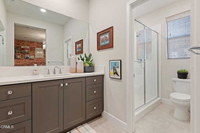 bathroom with walk in shower, vanity, tile patterned floors, and toilet