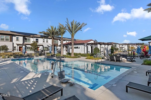 view of swimming pool with a patio area