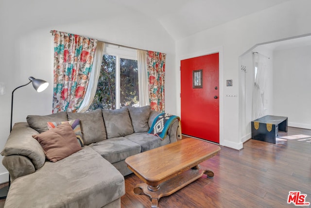 living room with lofted ceiling and dark wood-type flooring