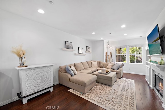 living room with dark hardwood / wood-style floors