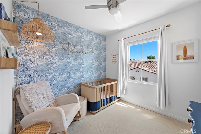 living area with ceiling fan and carpet floors