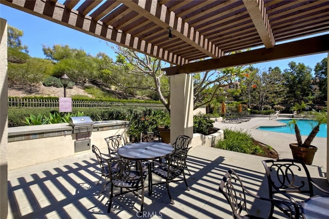 view of patio / terrace with a fenced in pool, area for grilling, and a pergola