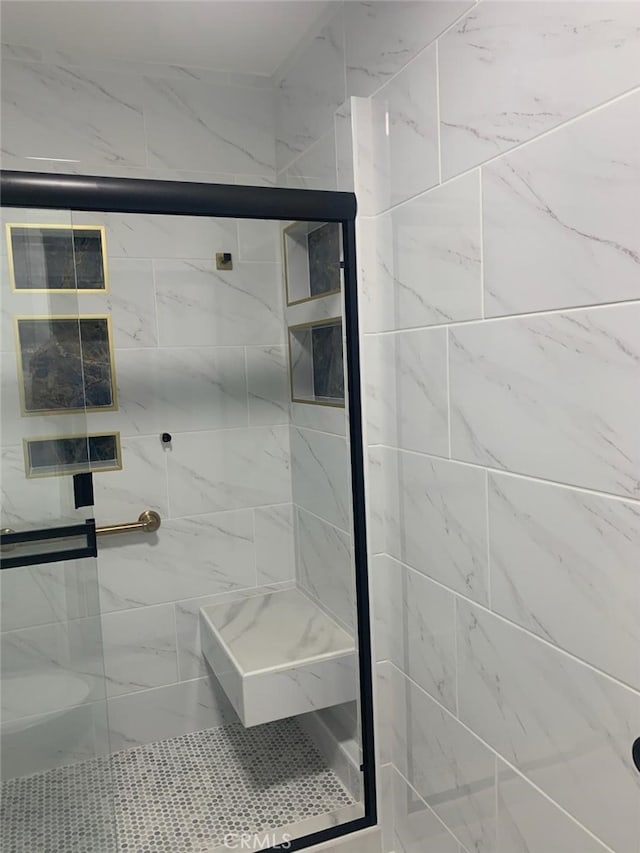 bathroom with an enclosed shower