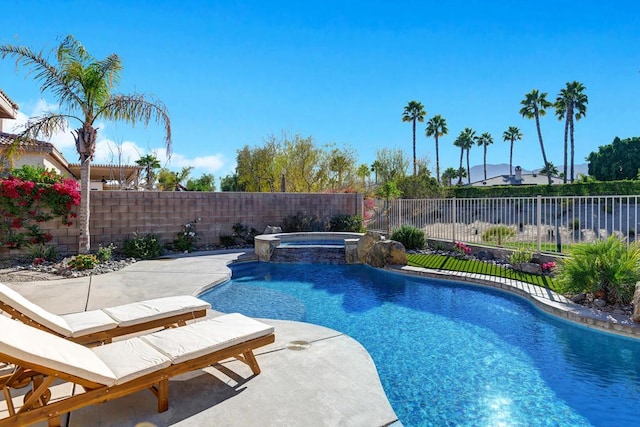 view of pool with an in ground hot tub and a patio area