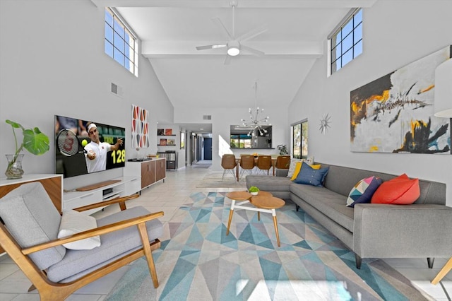 tiled living room with beam ceiling, ceiling fan with notable chandelier, and high vaulted ceiling