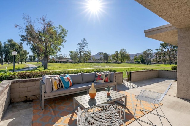 view of patio / terrace with a mountain view and an outdoor hangout area